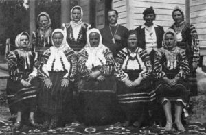The first Ladies'Auxiliary Seated l. to rt.: Helen Svekla Sec., Raveta Toma vice-pres., Veronica Toma President, Preoteasa Cohan, Anne Porozni Treas, Standing l. to rt.: Lena G. Hauca, Lena Suprovich, Father V. Cohan, Mary G. Mihalceon, Mary E. Suprovich.